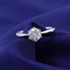 925 silver moissanite solitaire ring, blue fabric view