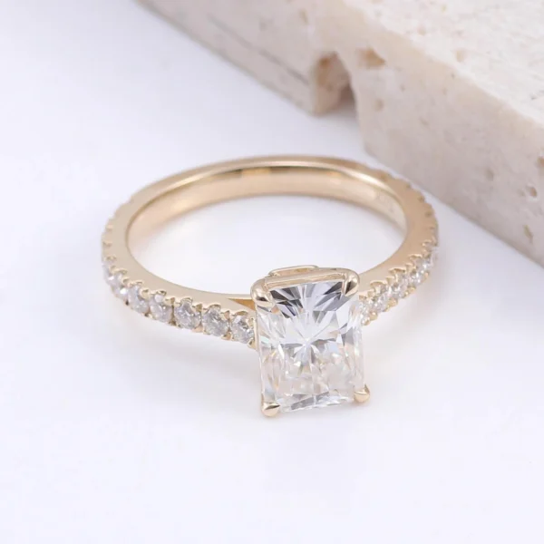 Product photograph showing a rectangular solitaire ring.