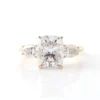 Product photograph showing the cushion three-stone ring.