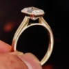 Product photograph showing the emerald bezel-set ring.