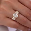 Cushion Moissanite Three-Stone Ring shown in the product photograph.