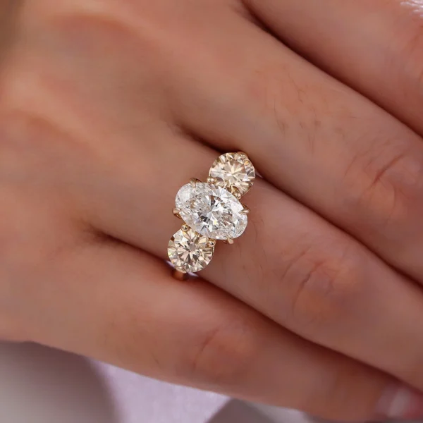Cushion Moissanite Three-Stone Ring shown in the product photograph.
