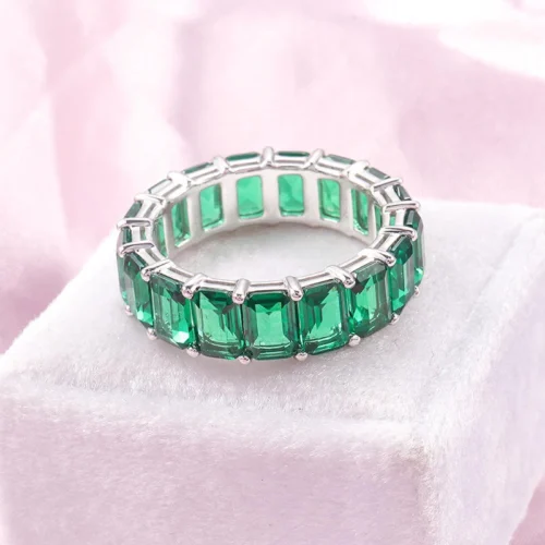 Product photograph showing the emerald eternity ring.