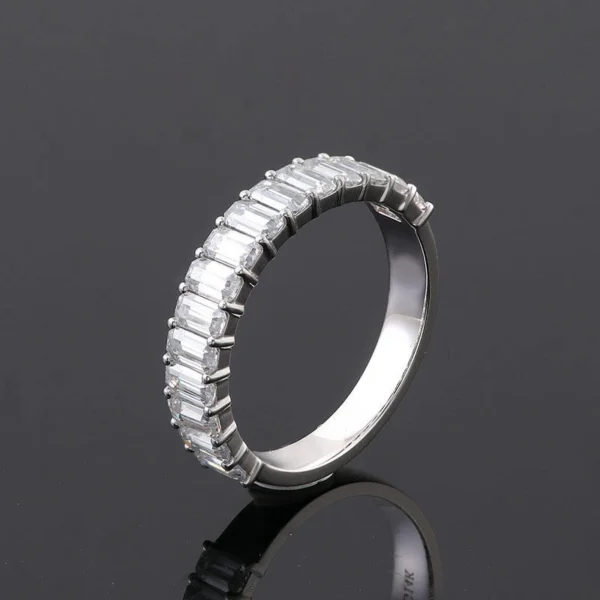Emerald Moissanite Eternity Ring in Gold shown in the product photograph.