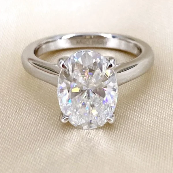 Product photograph showing the oval solitaire ring.