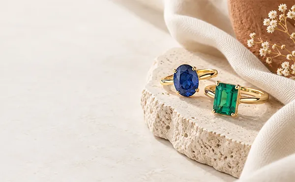 New season lab-grown emerald and sapphire rings
