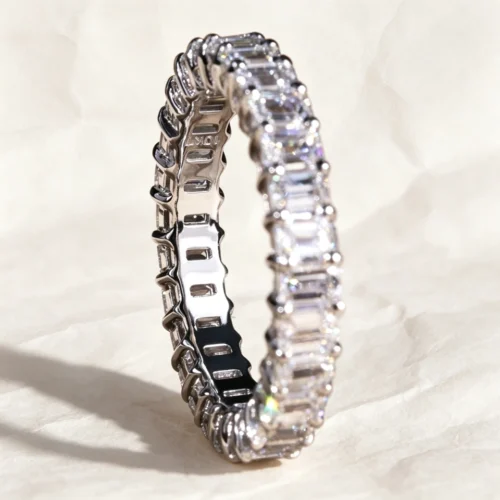 Product photograph showing the emerald eternity ring.