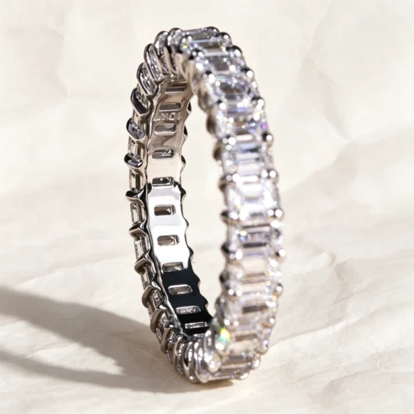 Product photograph showing the emerald eternity ring.
