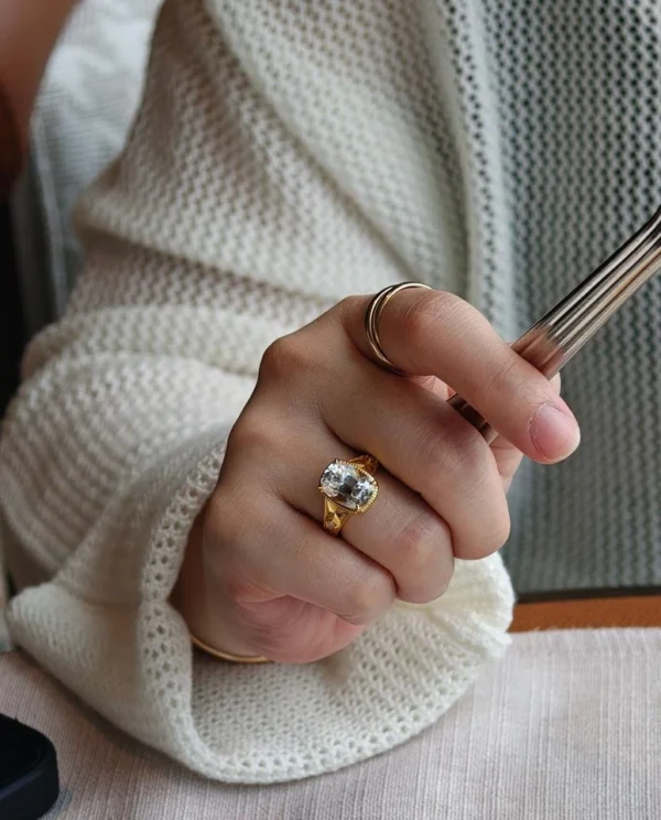 Additional product photograph showing the ring design, setting and band.