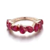Product photograph showing the pear half-eternity ring.