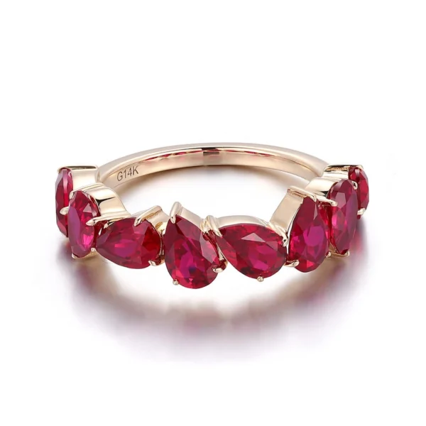 Product photograph showing the pear half-eternity ring.