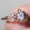 Product photograph showing the oval side-stone ring.