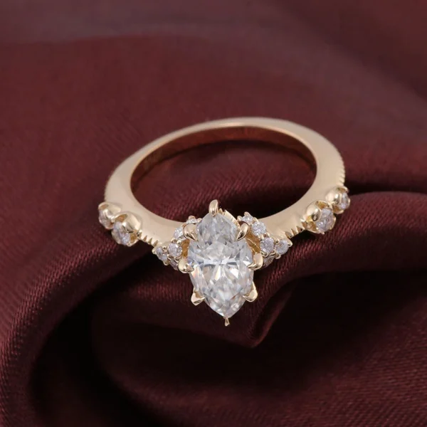 Jewelry design reference showing the ring setting and band. Marquise Moissanite Side-Stone Ring Design.