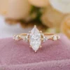 Jewelry design reference showing the ring setting and band. Marquise Moissanite Side-Stone Ring Design.