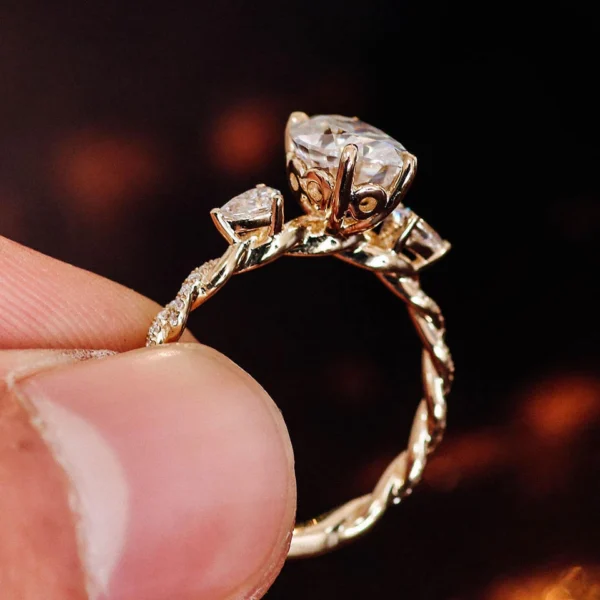 Jewelry design reference showing the ring setting and band. Oval Side-Stone Ring Design in 10K Gold.