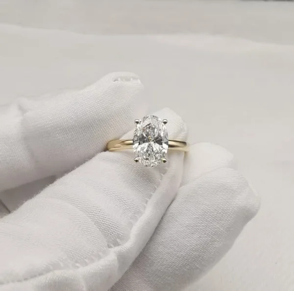 Additional product photograph showing the ring design, setting and band.