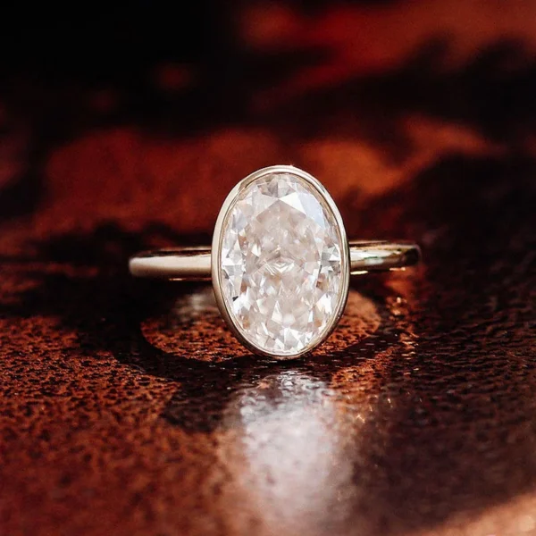 Oval Lab-Grown Diamond Bezel-Set Ring in Gold shown in the product photograph.