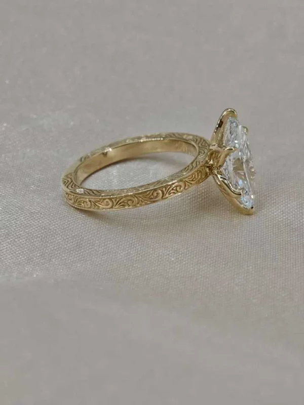 Additional product photograph showing the ring design, setting and band.