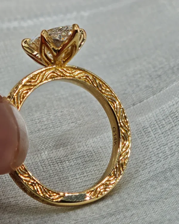 Additional product photograph showing the ring design, setting and band.