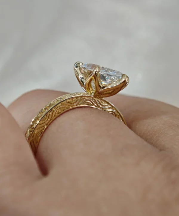 Additional product photograph showing the ring design, setting and band.