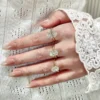 Additional product photograph showing the ring design, setting and band.
