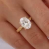 Jewelry design reference showing the ring setting and band. Oval Side-Stone Engagement Ring Design.
