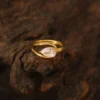 Pear Moissanite Ring in Gold shown in the product photograph.