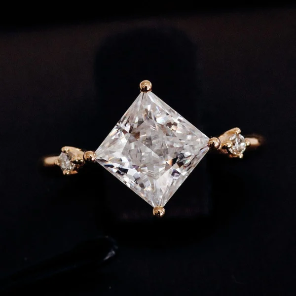 Princess Moissanite Ring in Gold shown in the product photograph.