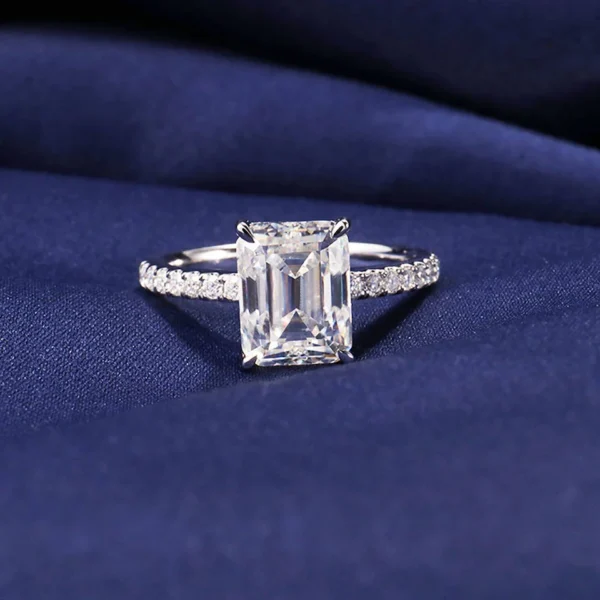 Product photograph showing the emerald solitaire ring.