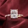 Product photograph showing the radiant side-stone ring.
