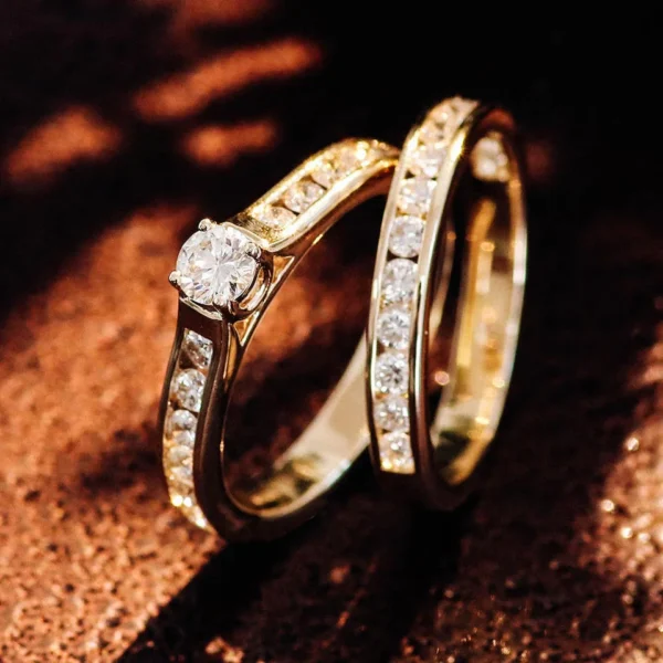 Product photograph showing the ring and companion band.