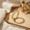 Additional product photograph showing the ring design, setting and band.