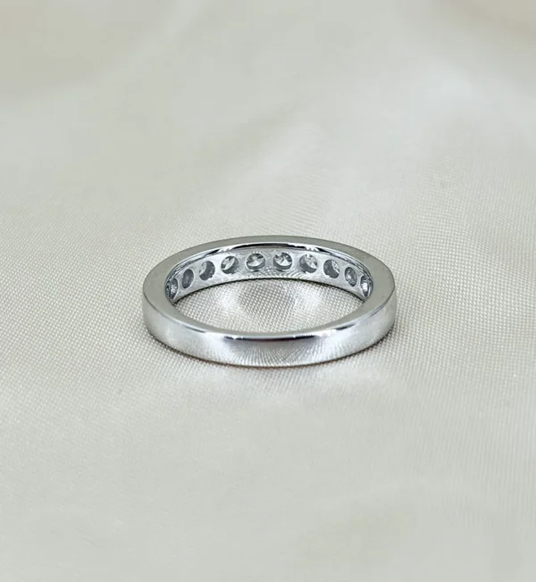 Additional product photograph showing the ring design, setting and band.