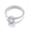 Additional product photograph showing the ring design, setting and band.