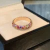 Round Moissanite Eternity Ring in 18K Gold shown in the product photograph.