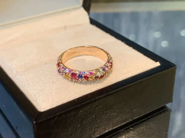 Round Moissanite Eternity Ring in 18K Gold shown in the product photograph.