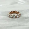 Round Moissanite Eternity Ring in 925 Sterling Silver shown in the product photograph.