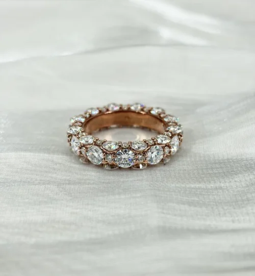 Round Moissanite Eternity Ring in 925 Sterling Silver shown in the product photograph.