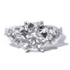 Product photograph showing the three-stone ring.