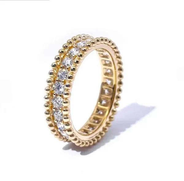 Round Moissanite Eternity Ring in Gold shown in the product photograph.