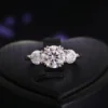 Product photograph showing the three-stone ring.