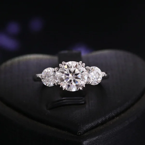 Product photograph showing the three-stone ring.