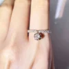 Round Moissanite Half Eternity Ring in Gold shown in the product photograph.
