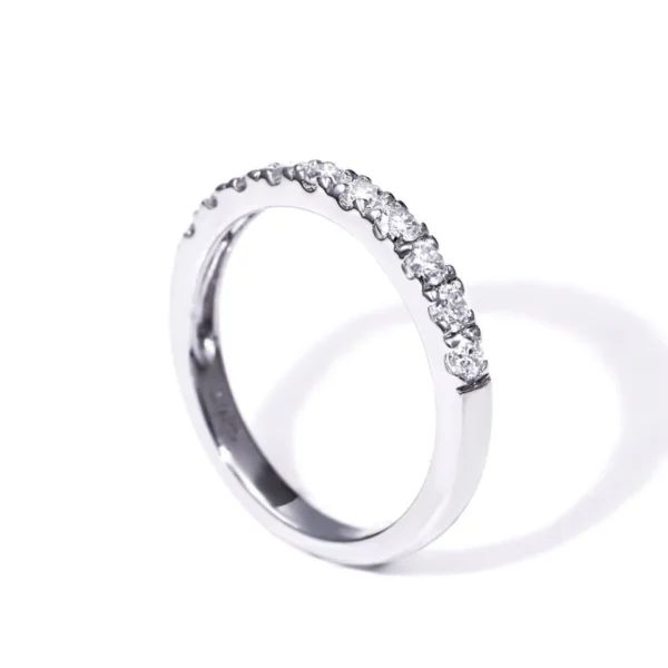 Round Moissanite Half Eternity Ring in Gold shown in the product photograph.