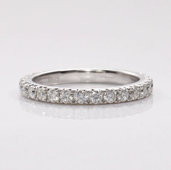 Round Moissanite Half Eternity Ring in Silver shown in the product photograph.