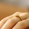 Additional product photograph showing the ring design, setting and band.