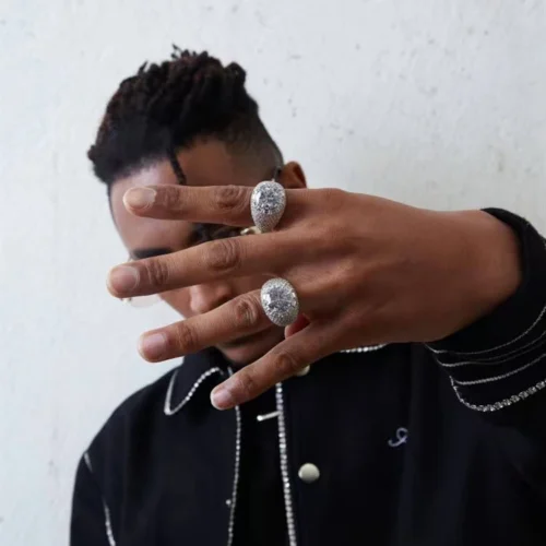 Multiple statement rings shown in a lifestyle photograph. Custom Moissanite Statement Ring Designs.