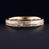 Product photograph showing the engraved band ring.