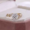 Round Moissanite Ring in Gold shown in the product photograph.