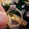 Additional product photograph showing the ring design, setting and band.